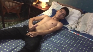 BarebackLatinoz: Young Santiago jerking uncut dick in the bed