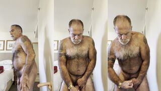Hairy bear strokes his big meat stick until it explodes with cum