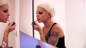 gorgeous blonde attends to her man s needs before going out