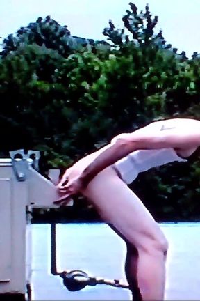 Crossdresser Riding a Giant Dildo on a Roof Top