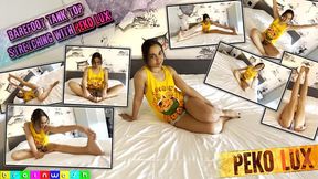 Barefoot Tank Top Peko Stretching on a Bed - WMV (HD 1080p)
