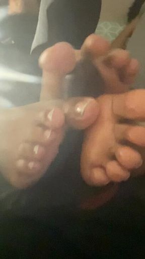 Double lesbian footjob