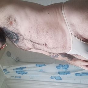 bear takes a shower, dries his hairy body and puts on a thong with his big ass