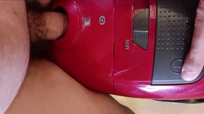 The lope bangs her vacuum cleaner