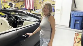 MILF gives a blow job in the car's backseat