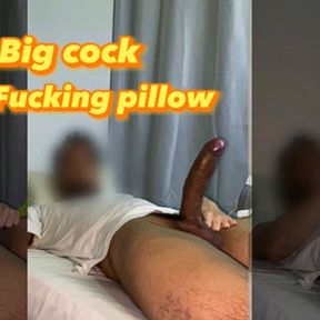 Excited young man fucks a pillow with his huge cock