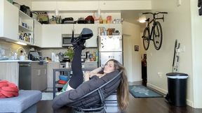 Effigy finger combs her long hair and fans it over the chair.