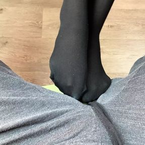 Girl in black stockings play with her boyfriend under table and gets a lot of cum on her feet after footjob