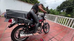 The beautiful Dalilah struggles with the motorcycle before setting off