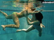 Two sexy amateurs showing their bodies off under water
