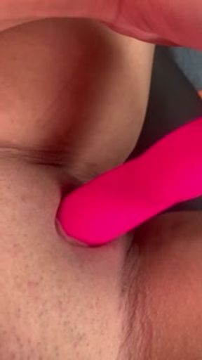 Playing with myself in my truck, using a vibrator.