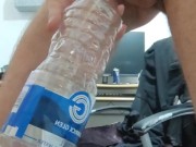 Pissing in the empty bottle like a champ