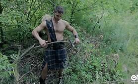 Cute shirtless guy in scottish kilt playing with cock after hard work
