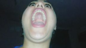 A realistic young woman yawning widely, clearly showing the roof of her mouth