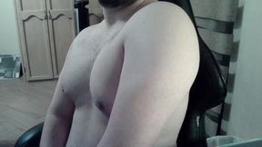 Hot beefy camboy shows off the goods during a show