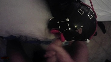 Laura is hogtied in latex catsuite and high heels, throated with a lip open mouth gag POV