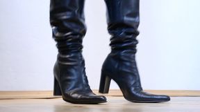 office girl standing in front of you in shiny pointed leather boots toe and heel tapping av2