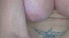 Busty milf plays with two dildos in the bathroom