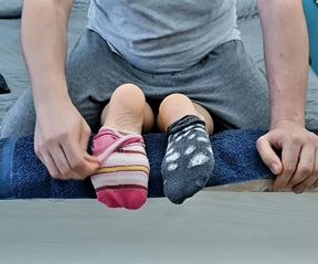 Mismatched socks and barefoot tickling