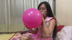 Looner Savannah student look blow to pop pink balloon