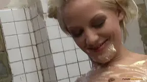 Brunette hottie loves smearing food all over a busty blonde babe