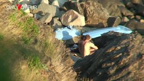 secret camera records horny young pair fucking between beach rocks