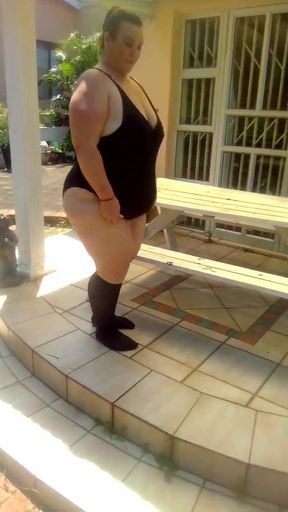 Curvy Beauty in Black Stockings Teases with an Outdoor Strip