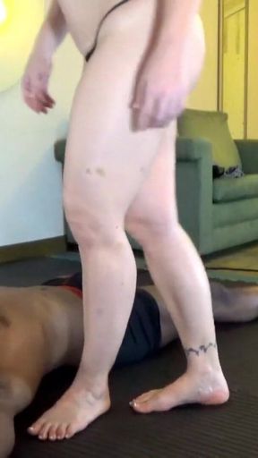 Black Guy Serves Her for Stepping on Him and for Making Him as Her Human Furniture