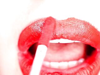 4K Applying red lipstick and smokin' hookah on black background