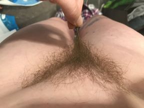 Horny housewife shows you exactly how to turn her on by running her fingers along her pubic hairs