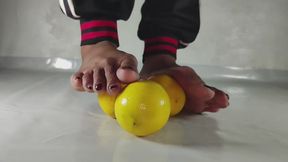 Extreme close up Crushing Lemon barefoot