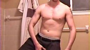 After a busy day Shawn is in the bathroom getting ready to shower and decides to play with himself through his pants. He strips and flexes for the camera, while stroking his hard cock, and soon Shawn blasts a warm cum load onto his chest.