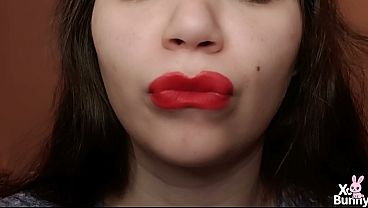 Close up of red lips smoking