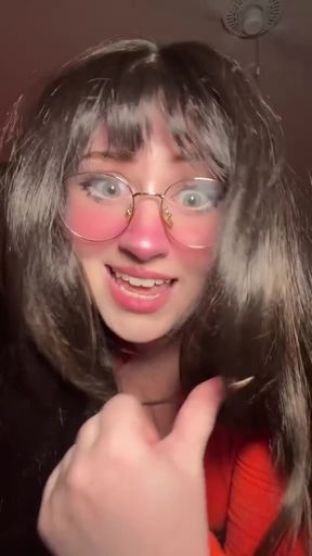 Woman in wig giving thumbs up