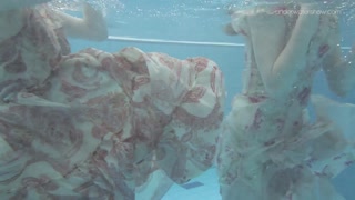 Two dressed beauties underwater Anna Netrebko and Lada Poleshuk