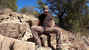Wetting jeans while rock collecting outdoor