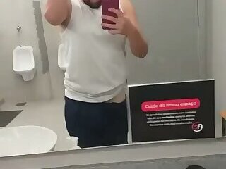 I almost got caught exposing myself in the gym bathroom, and the guys almost caught me.
