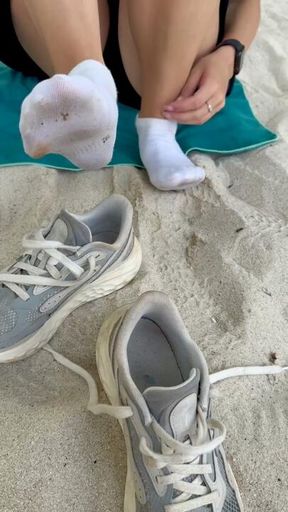 Sweaty White Socks and Sneakers Off at the Beach