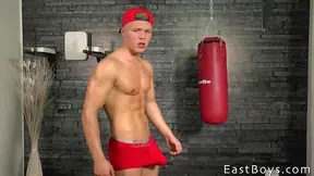 Peter Homely pouts at the camera while showing his muscles