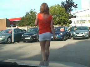 Filming sexy skanky tranny on the parking lot in different clothes