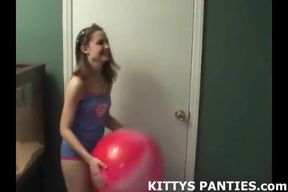 Kitty blowing bubbles in her miniskirt