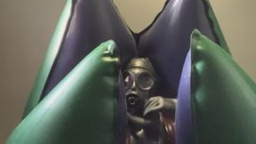 Layers of Tight Rubber, a Gasmask and an Inflatable Alien Egg.