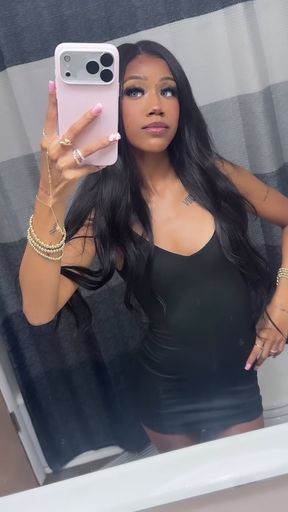Black woman in black dress