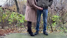 Mother-in-law in leather skirt and heels holds son-in-law's dick while he pees