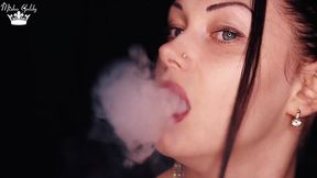 Long-legged queen seductively smokes a hookah wearing lipstick