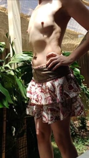 Trying on skirts nude outdoors, small boobs, hairy bush, petite