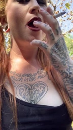 Horny Redhead Seductively Smokes