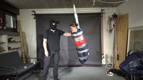 Marie taped and suspended in shiny nylon Rainwear