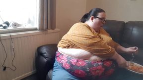 SSBBW huge belly whilst eating on sofa