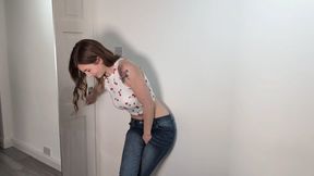 Desperate girl pees her jeans